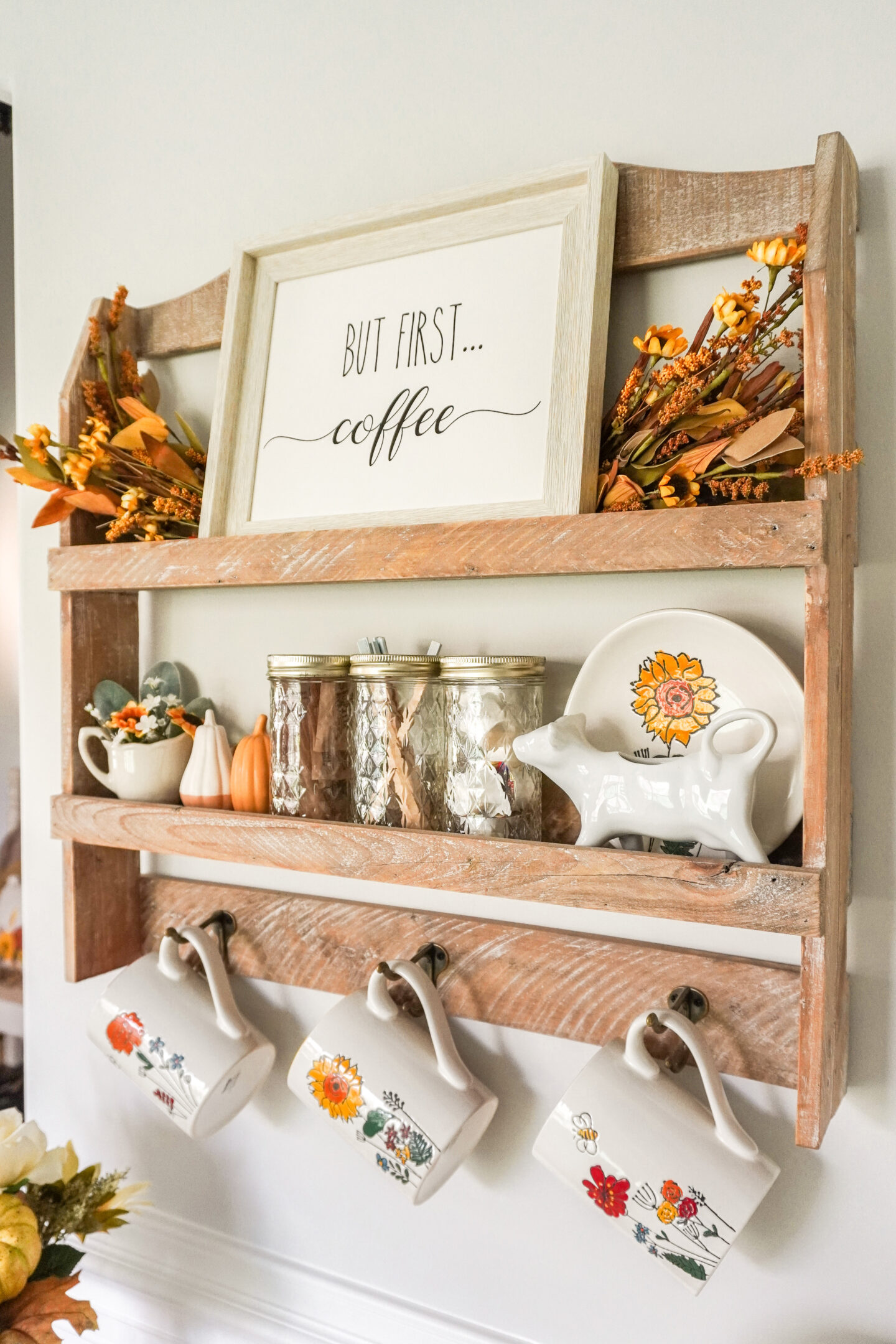 coffee bar shelf with hooks decorated for fall