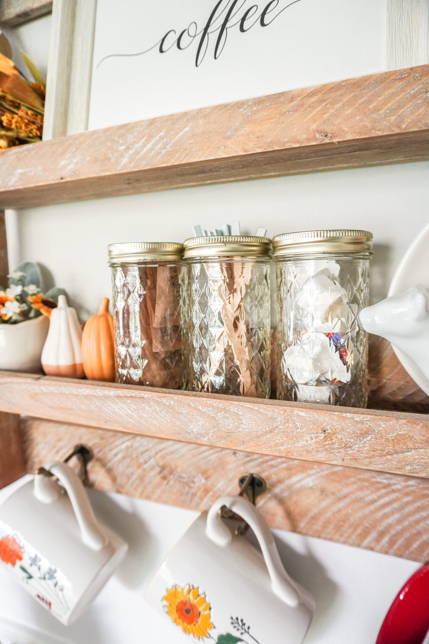 vintage ball jars filled with sugar, stir sticks and creamer for a fall coffee bar