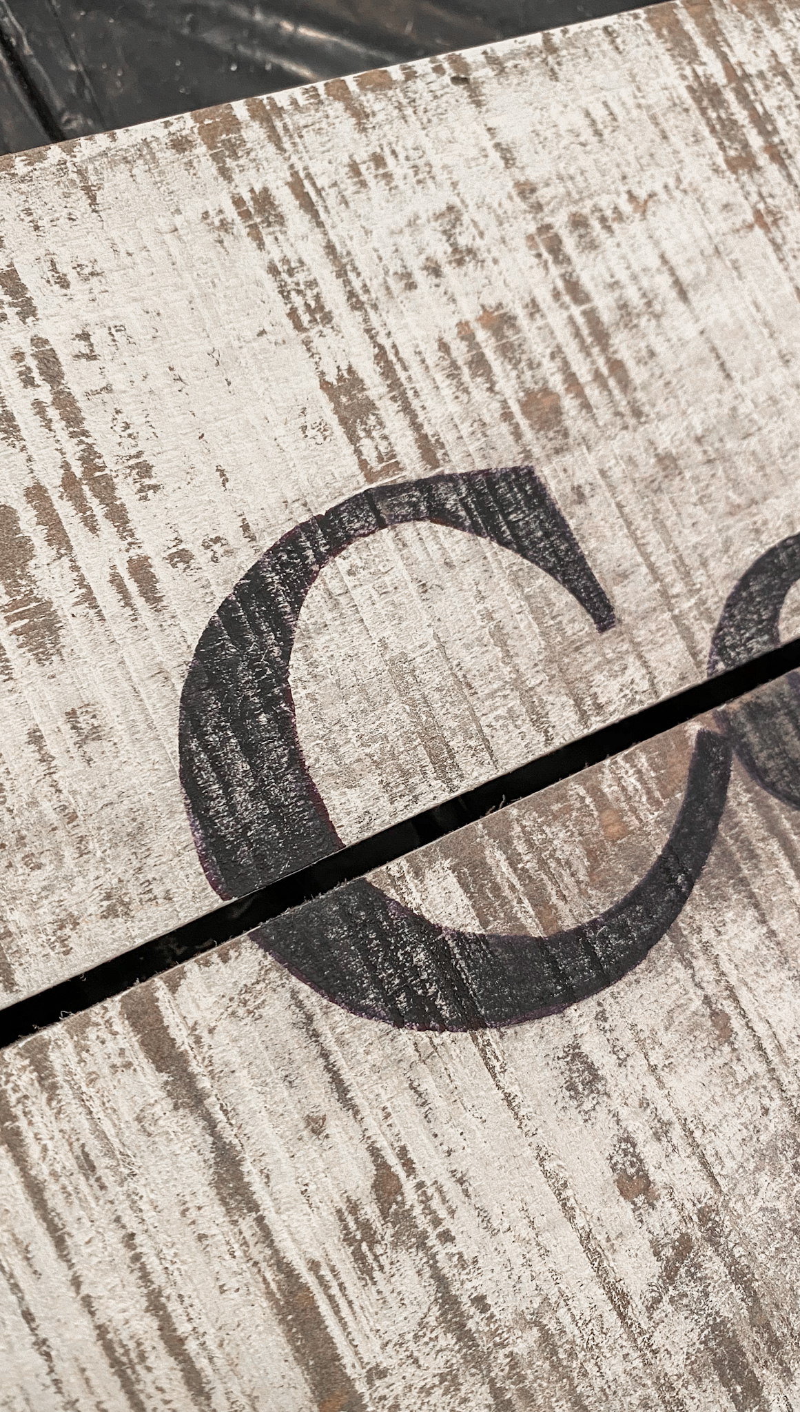 distressed and white washed wood with distressed font.