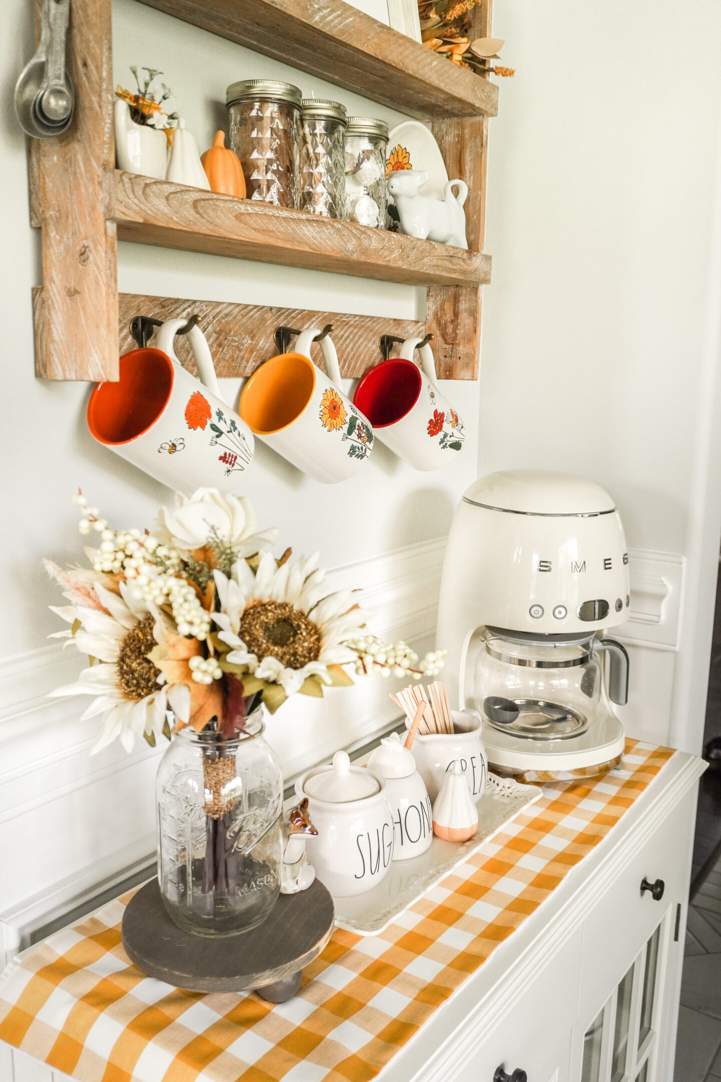 fall coffee bar complete with smeg coffee maker and colorful mugs